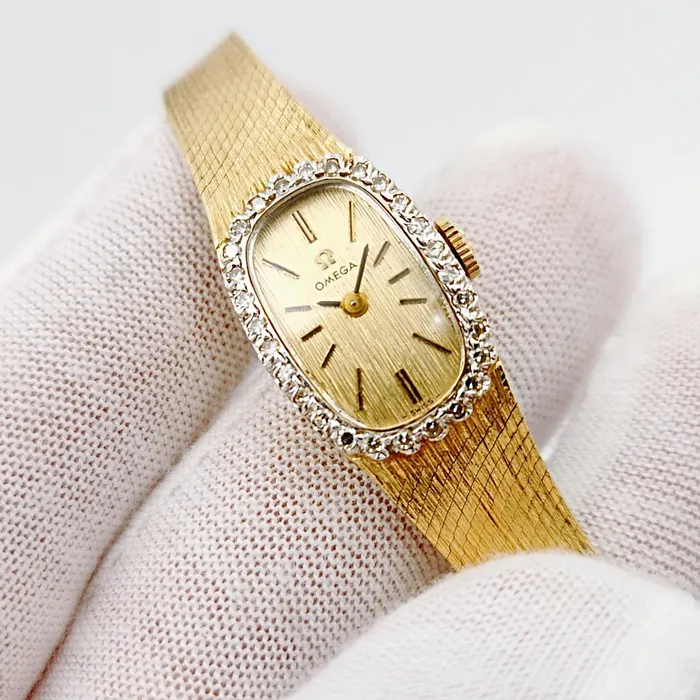 Ladies Omega 20mm Petite Vintage 14K Yellow Gold Automatic Watch with Gold Dial and Diamond Bezel PreOwned Omega PreStyled Sets