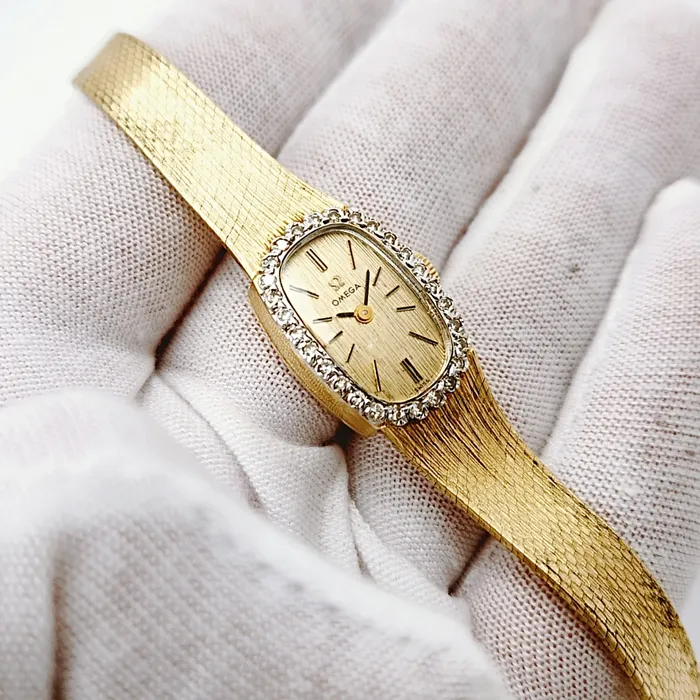 Ladies Omega 20mm Petite Vintage 14K Yellow Gold Automatic Watch with Gold Dial and Diamond Bezel PreOwned Omega PreStyled Sets