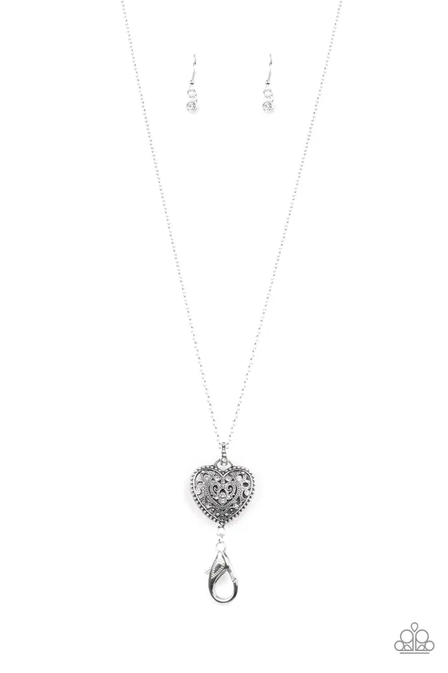 Paparazzi Accessories Necklaces Charmingly Casanova Paparazzi White Rhinestone Silver Heart Pendant Lanyard Paparazzi Accessories Necklaces Charmingly Casanova Paparazzi White Rhinestone Silver Heart Pendant Lanyard